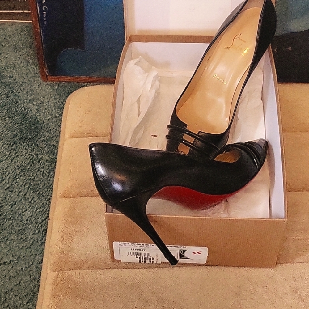 Christian Louboutin, 7.5 shoe size, black heel with panther tip, red bottoms